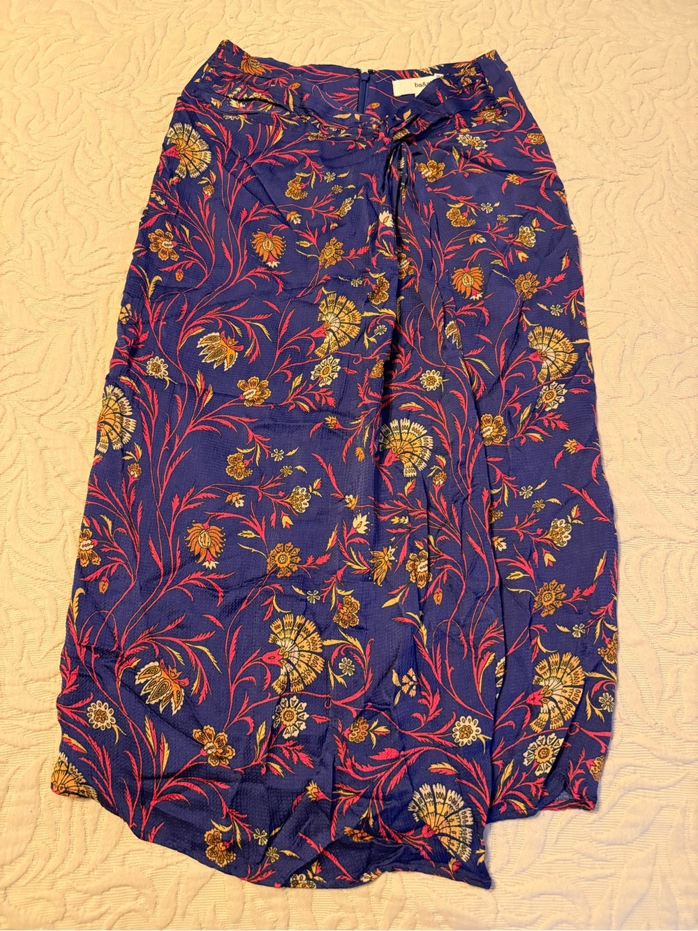 Ba&sh Faux Wrap Skirt featuring a blue floral print and a soft draping design